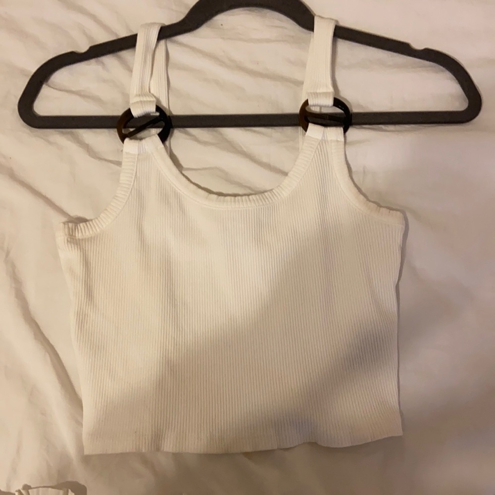 white tank with tortoise ring detail